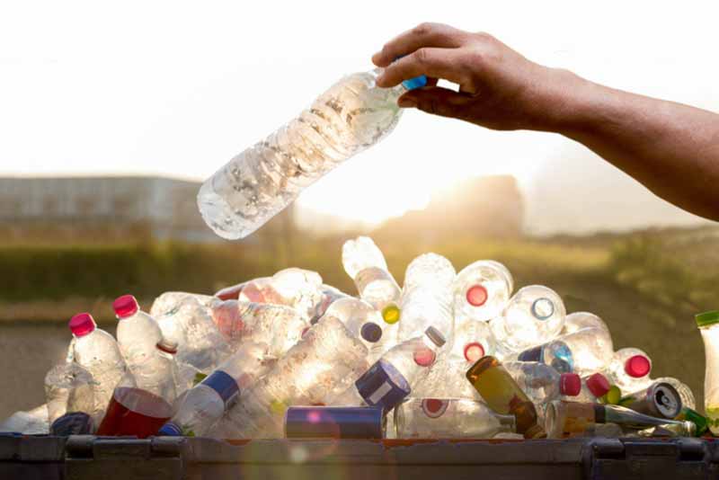 recyclable plastic bottles stacked on top of eachother