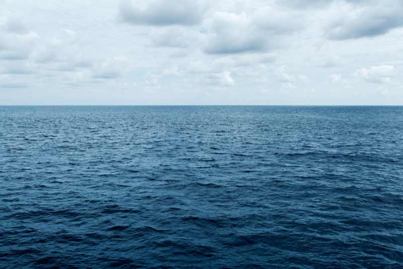 expansive ocean extending over the horizon